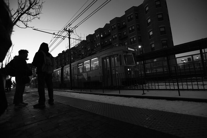 Commuters wait on a MBTA Green Line train on a frigid afternoon at the Museum OF Arts Platform in Boston, 2017